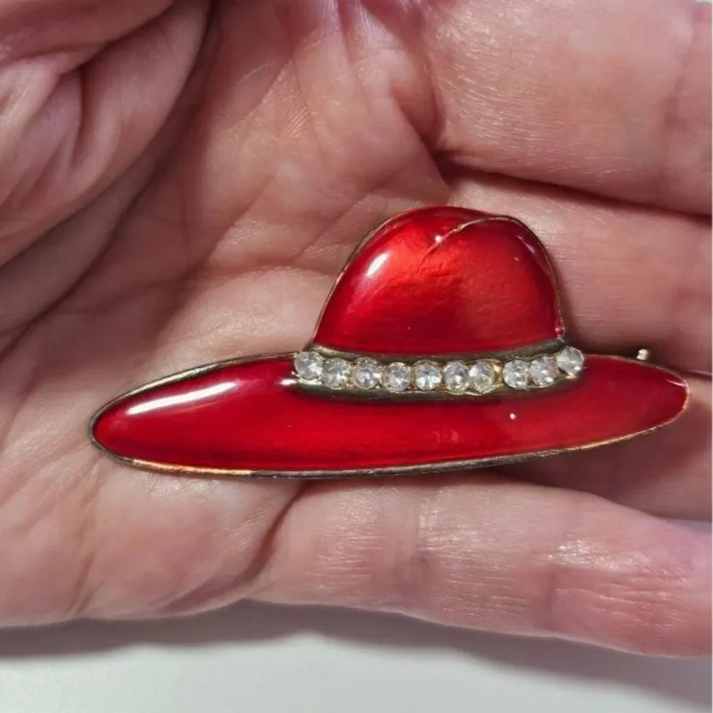 Gold tone red hat society brooch